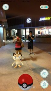 A couple of my friends and I catching a Meowth after our strength training.